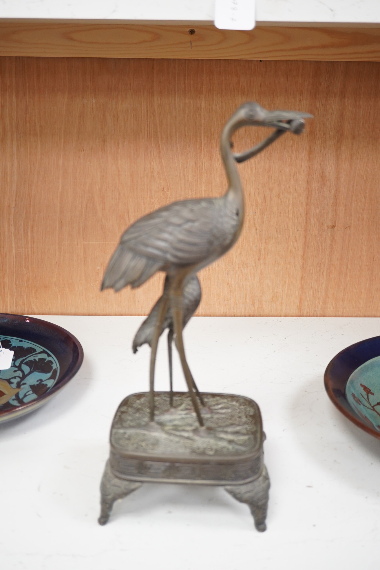 A Japanese bronze group of cranes, 19th century, 39cm high. Condition - section missing from prey in mouth